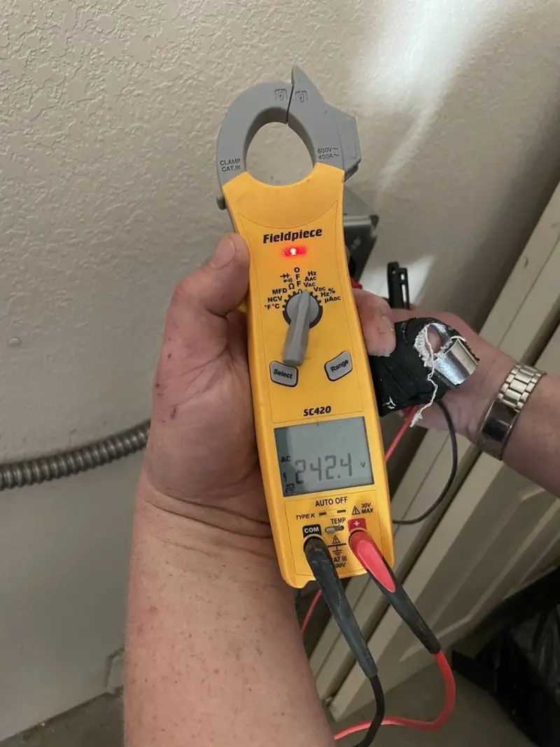 Voltage testing with clamp meter during Generator Installation in Bee Ridge